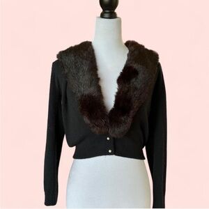 Vintage black 1950’s cropped cardigan with fur collar and pearl buttons.